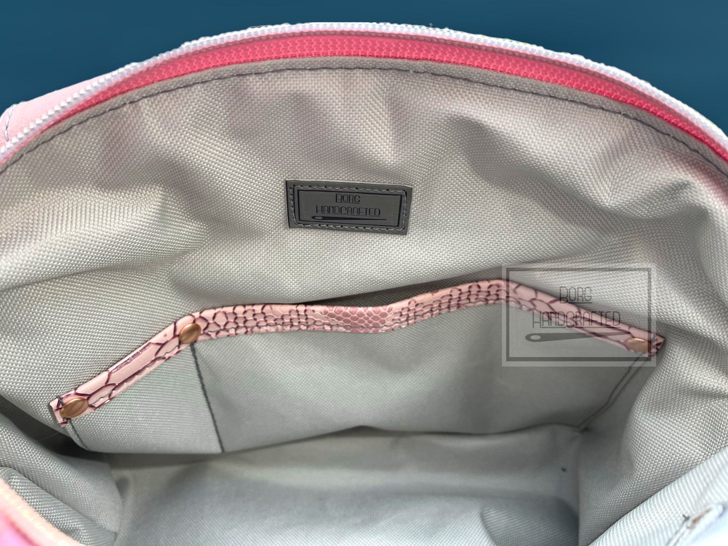 Lola blush pink faux snake handbag